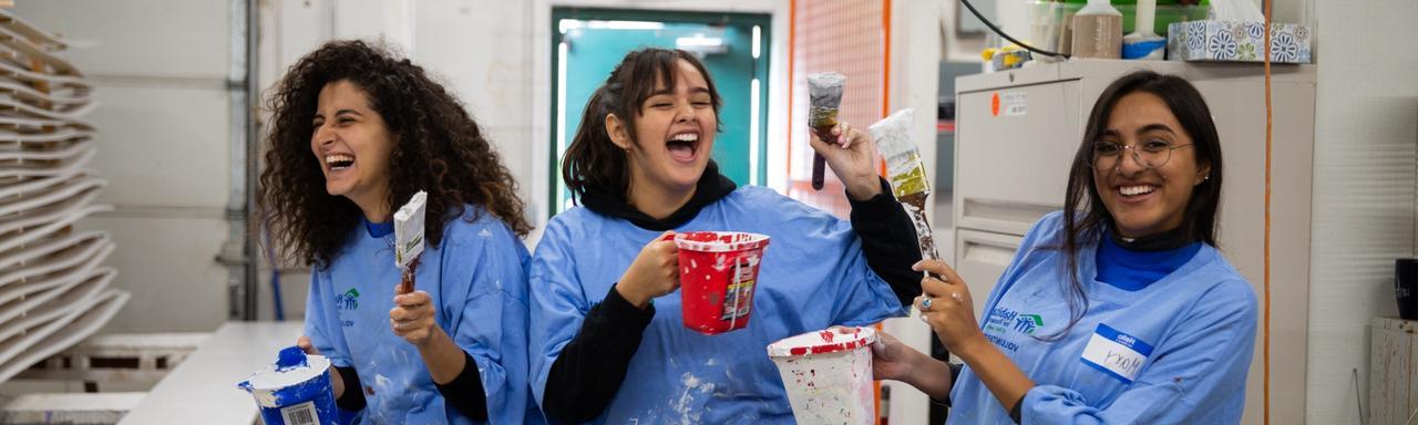 Volunteers painting on Make A Difference Day